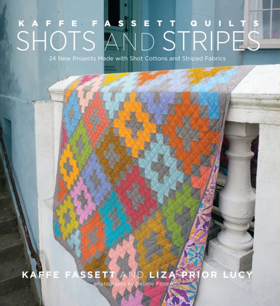 Cover art for Kaffe Fassett quilts : shots and stripes : 24 new projects made with shot cottons and striped facbrics / Kaffe Fassett and Liza Prior Lucy ; photographs by Debbie Patterson.