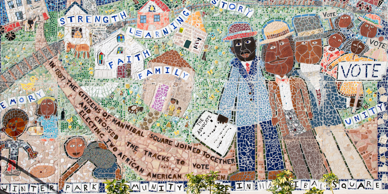 A tile mosaic depicting the Black community of Hannibal Square crossing the tracks to vote. Text reads, "Strength, Learning, Story, Faith, Family, Memory, Unity." "In 1887 the citizens of Hannibal Square joined together and crossed the tracks to vote, electing two African American men." "Winter Park Community Pride in Hannibal Square."