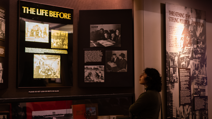 A person looking at an exhibit at the Holocaust Memorial Resource & Education Center of Florida